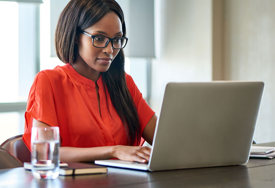 Woman typing on laptop