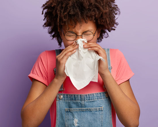 Woman Blowing Nose