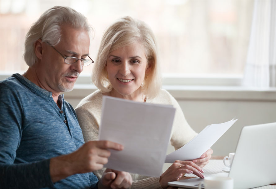 Older couple looking at paperwork