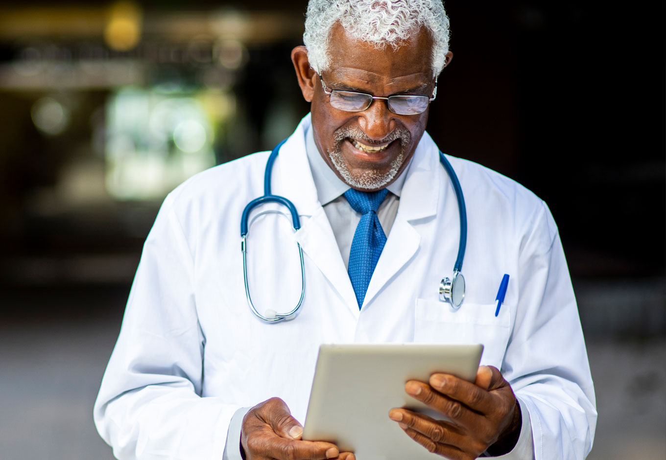 Doctor looking at tablet