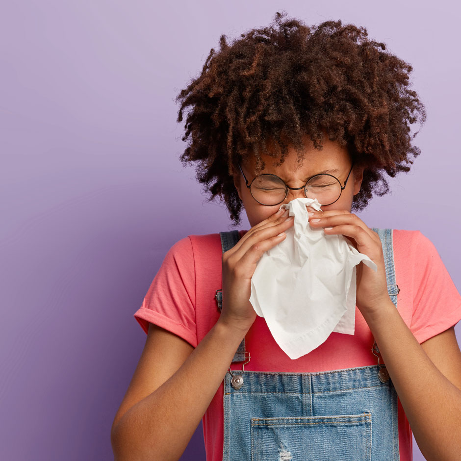 girl blowing her nose